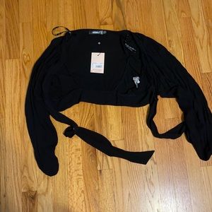 Brand new missguided blouse long sleeve. Ties in the front